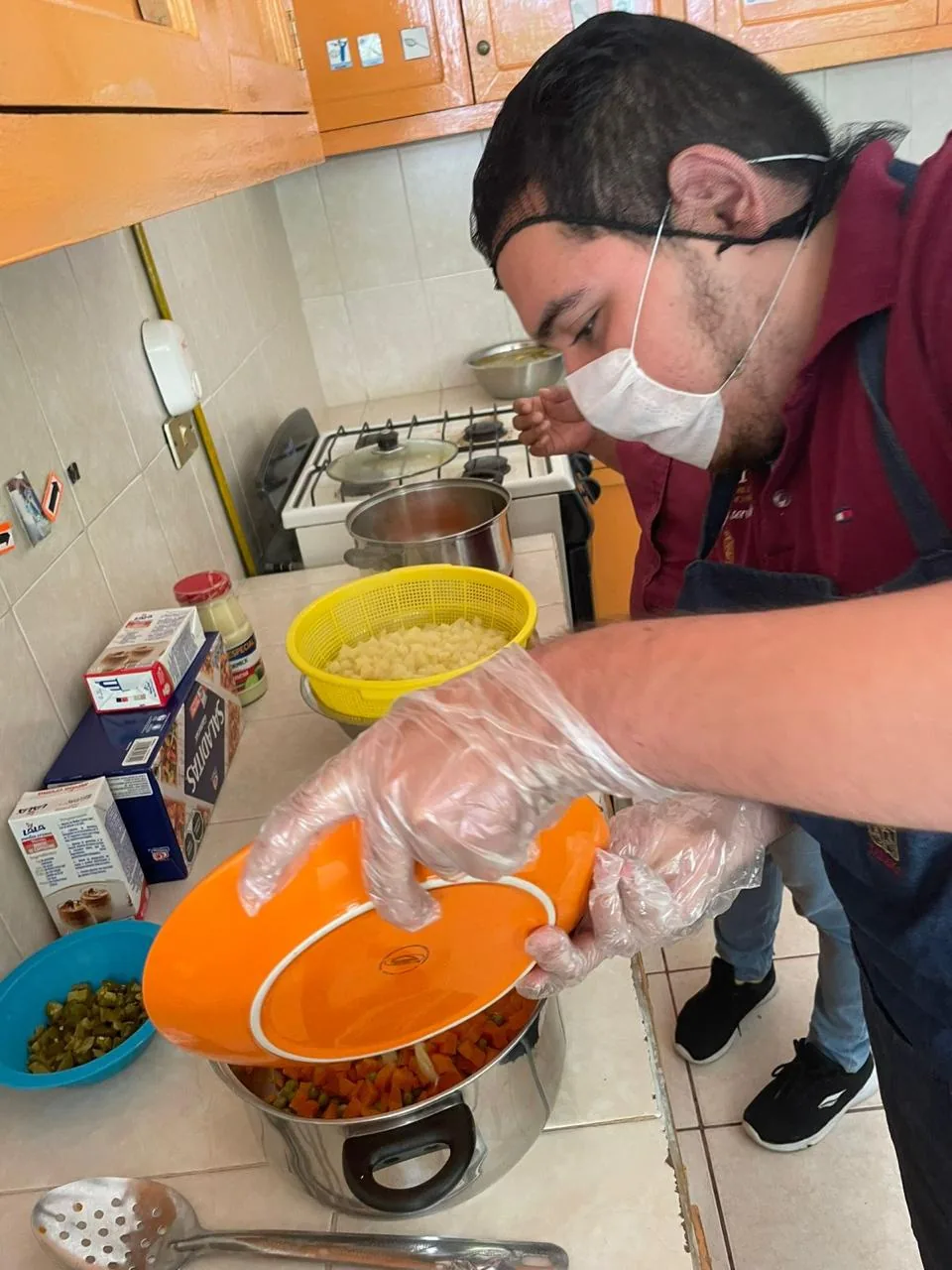 Participant taking part in a cooking activity at CRIAT